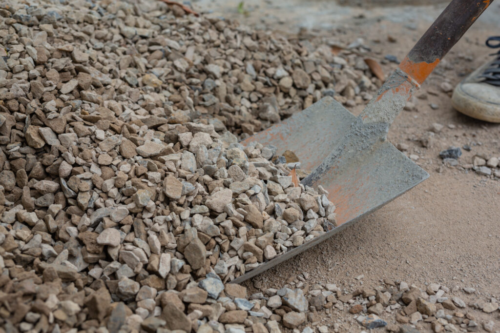 Construction technicians are mixing cement, stone, sand for construction.